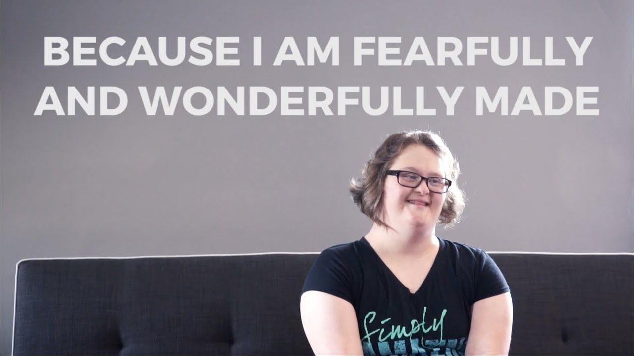 woman with Down syndrome sitting on couch with text that says "because I am fearfully and wonderfully made"