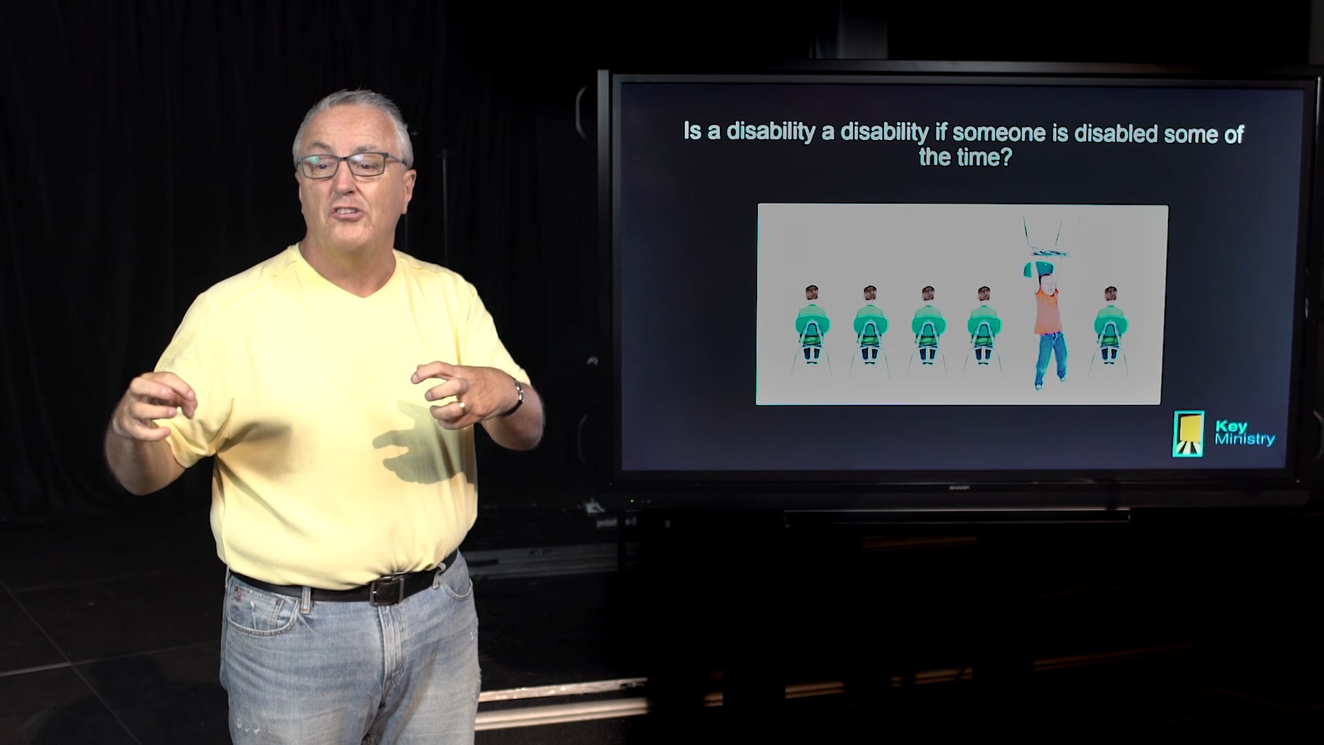man teaching on disability using a screen