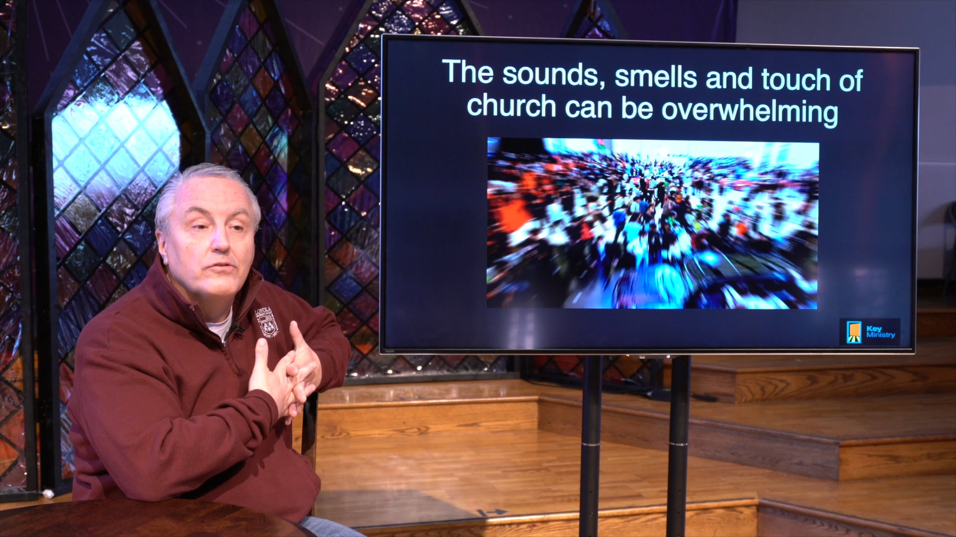 man talks about sensory processing in church using screen