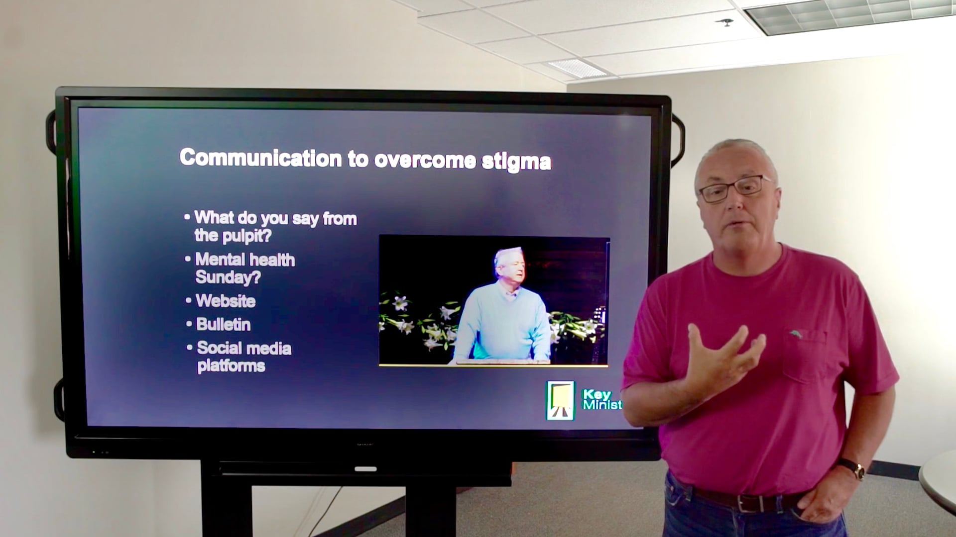 man teaching on mental health stigma in church using screen