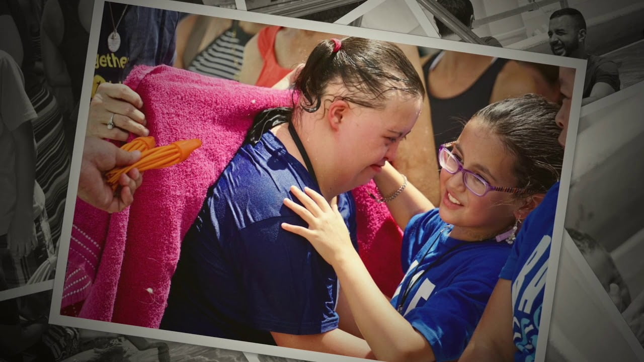 woman with Down syndrome being baptized