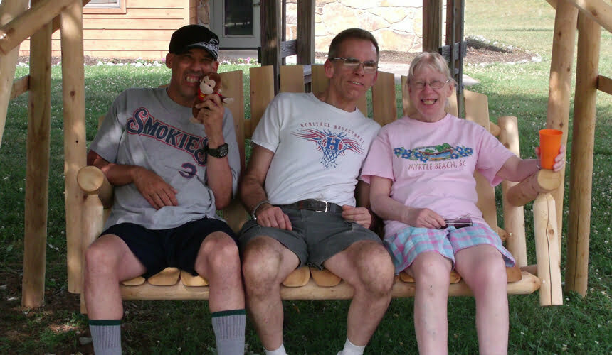 a group of people sitting on a bench