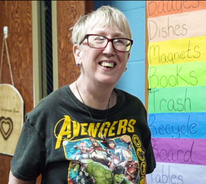 woman in Avengers shirt wearing glasses