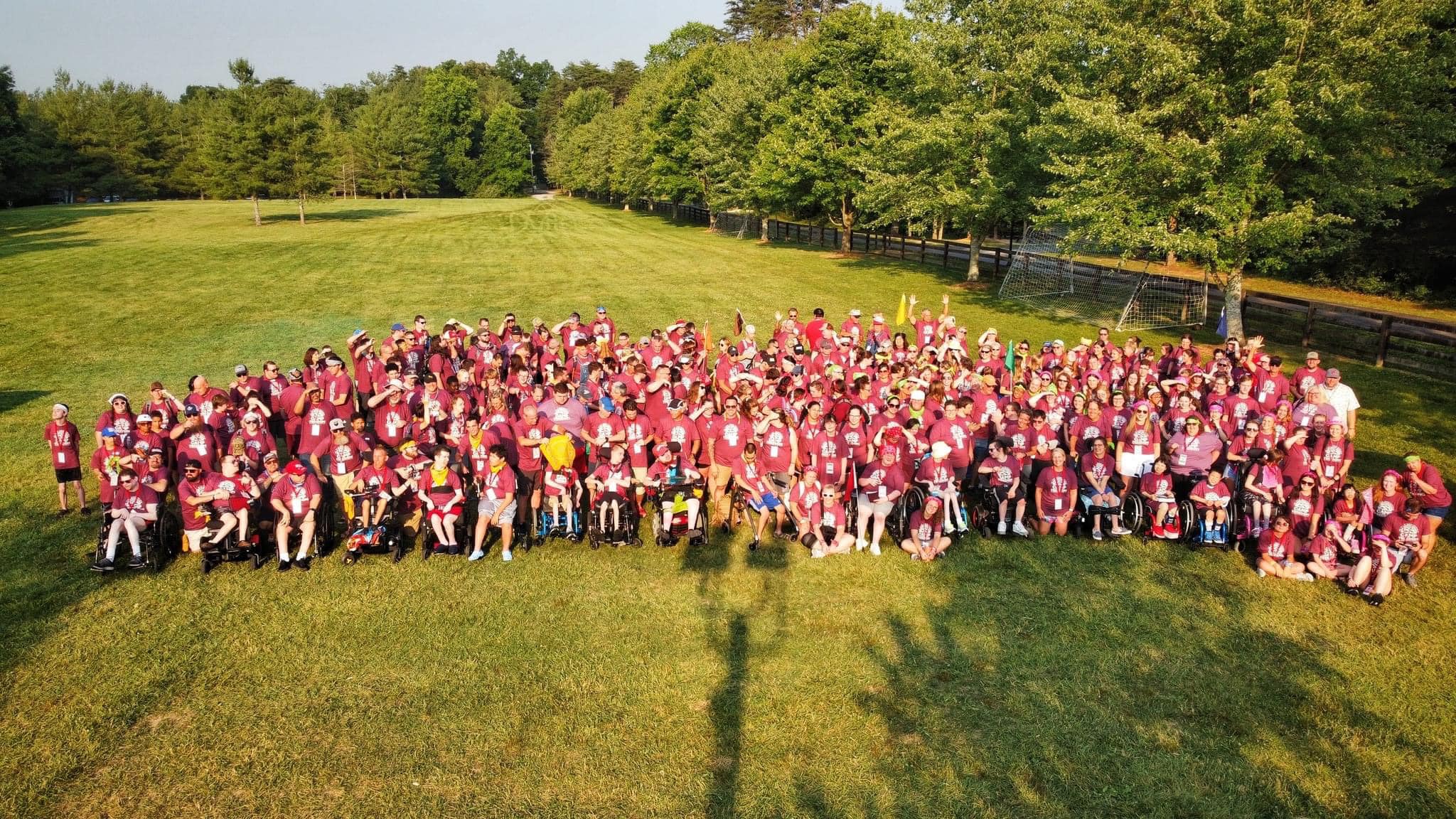 A group photo of campers and volunteers taken from a drone.