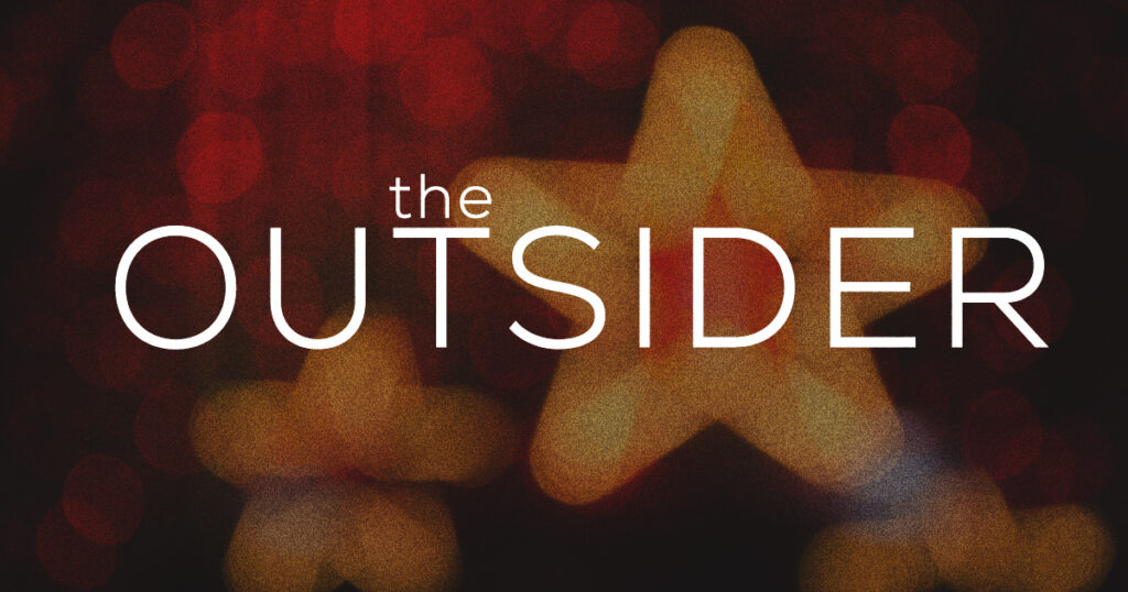 Text The Outsider appears over a blurred background with yellow stars and red lights, creating an outsider vibe.